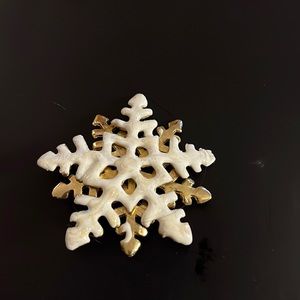 White enamel snowflake pin